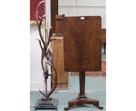 A lot comprising a 20th century faux stag antler standard lamp, 149cm high and a Victorian mahogany tilt top occasional table