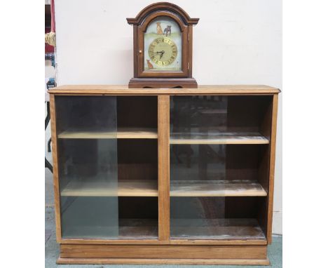 A lot to include an early to mid 20th century oak bookcase with glass sliding doors, 80cm high x 100cm wide x 27cm deep and a