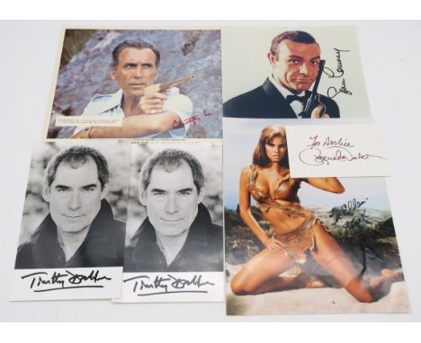 AUTOGRAPHS A small collection of James Bond signed photographs, comprising Sean Connery, Timothy Dalton (x2), Raquel Welch an