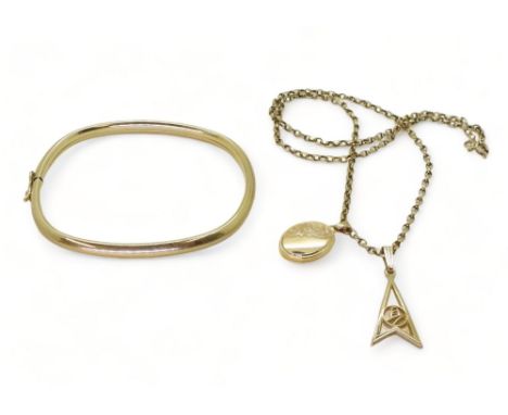 A 9ct gold bangle, chain and two pendants, weight together 13.9gms Condition Report:Available upon request