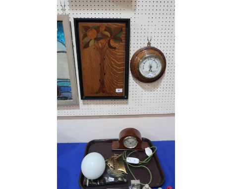 A wooden inlaid panel depicting&nbsp; fruiting tree, signed Rowe, a round barometer, a French Art Deco ship lamp and a mantle