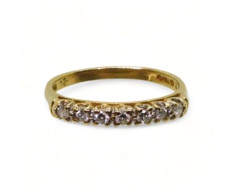 An 18ct gold diamond half eternity ring, set with estimated approx 0.20cts of brilliant cuts, size O1/2, weight 2.4gms Condit