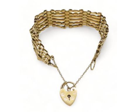 A 9ct gold gate bracelet with a heart shaped clasp, weight 12.1gms Condition Report:Available upon request