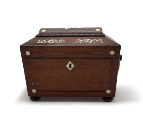 A Regency style mother of pearl inlaid tea caddy of casket shape with ring handles and two compartments Condition Report:Avai