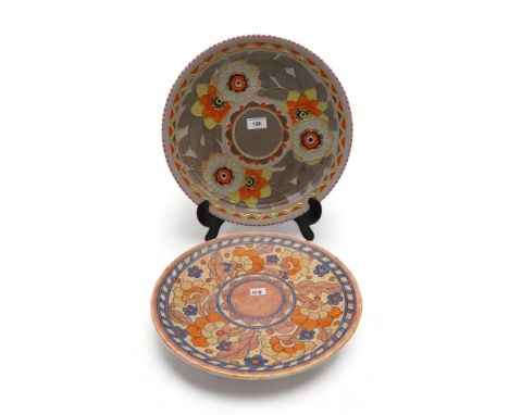 A Charlotte Rhead for Crown Ducal charger, tube lined with Art Deco style decoration of flowers in orange, yellow, silver and