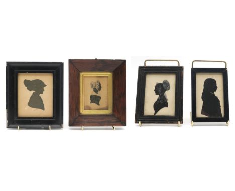 A 19th century silhouette portrait miniature of a lady in profile, housed in a rosewood frame with gilt slip, measuring appro