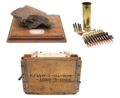 A heavy shrapnel fragment set upon a plinth base with plaque affixed reading "Piece of German Shell found at Hartlepool after
