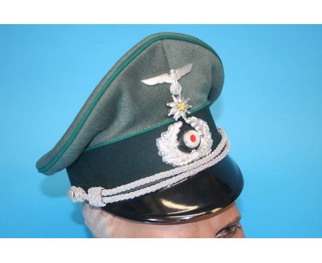 A German Gebirgstruppe (Mountain Troop) Non-Commissioned Officer's (NCO) visor cap, with metal eagle, swastika badge, Edelwei