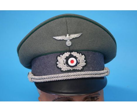 A German Wehrmacht Beamte (Army Administration) Officer's visor cap, stamped Pekuro, by Peter Kupper, Ronsdorf