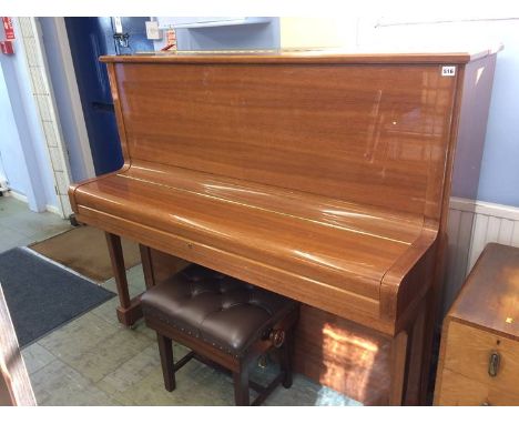 A Steinway and Sons 'Model K' Upright piano, in a walnut veneered high gloss (polyester) finish, with third piano. Serial num