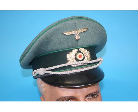 A Jager (Light Infantry) Officer's visor cap in light green, marked Pekuro, Stirndruckfrei Deutsches Reichspatent, Peter Kupp