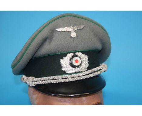 A German Jager (Light Infantry) Officer's visor cap, stamped 'Bamufa'