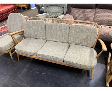 An Ercol spindle back Golden Dawn three seater settee