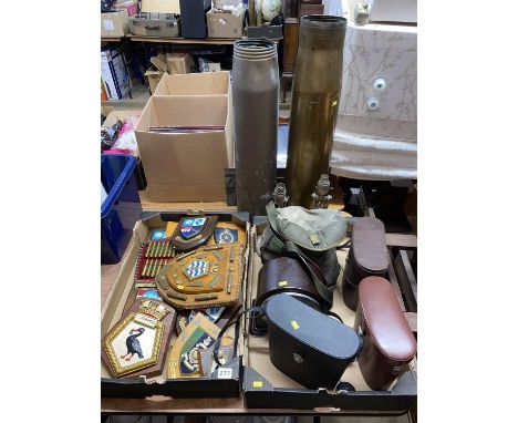 Two trays of binoculars, Bakelite clock, military plaques and a pair of gimbled brass table lamps