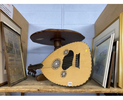 A 20th Century lute, laminated wood tripod table, plus framed artwork including a 1960s music poster