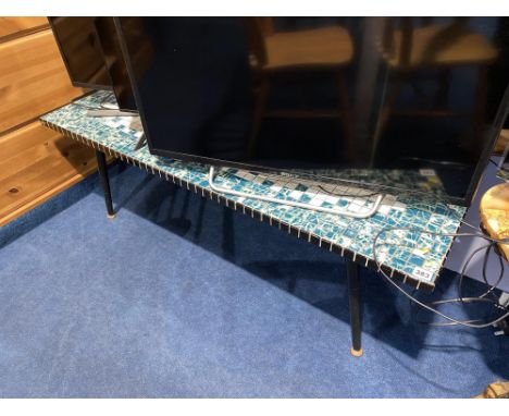 A retro tile topped table, measuring 42cm x 122cm x 46cm