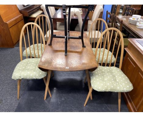 An Ercol Golden Dawn table and four hoop back chairs