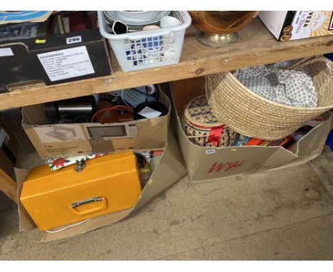 An assorted collection of wicker baskets, tools and toys