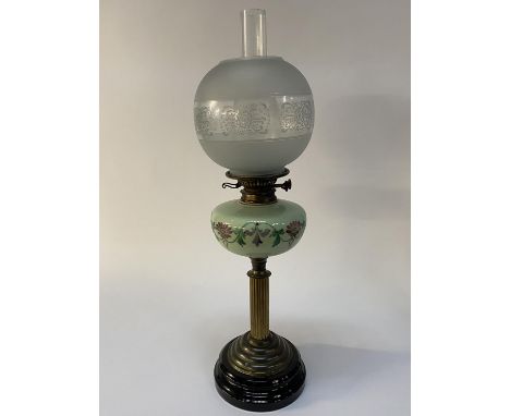 A Victorian oil lamp with etched glass shade and opaque green reservoir, H 70cm