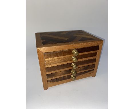 A Mahjong set, displayed within a five tiered hardwood chest, 19cm x 25cm x 19cm