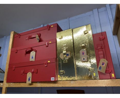 Four red stitched leather suitcases and two gold colour suitcases of Paddington Bear interest