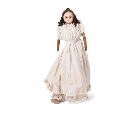 Wax head antique doll in white dress with leather arms. Height 59cm. c1840.  In good antique condition with some light wear c