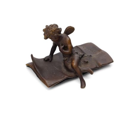Ernest Justin Ferrand (French 1846-1932) a small patinated bronze figure of cupid seated on a letter, signed Ferrand, 9.5cm w