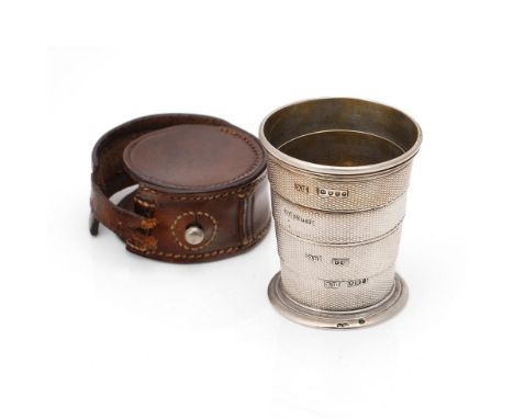 Victorian silver collapsible cup, vacant cartouche, and with engine turned decoration, in original leather case, London 1861,
