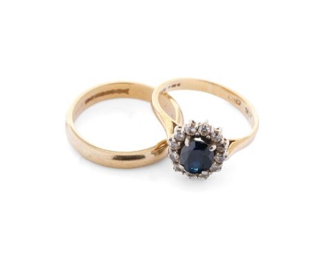 An 18ct yellow gold wedding band, 3.6 grams, size K, with an 18ct gold sapphire and diamond cluster ring, size I/J, 3.1 grams