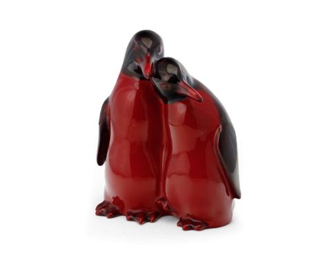 Royal Doulton flambe pair of huddling penguins 109, 15cm tall.  In good condition with no obvious damage or restoration, ligh