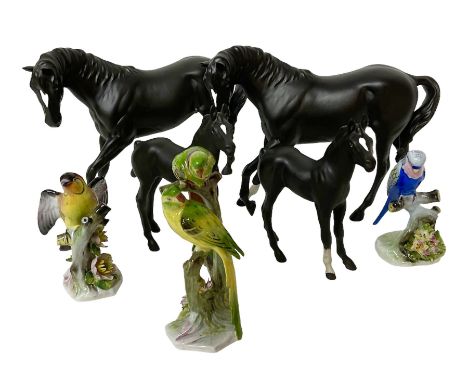 Four Beswick black matte horse figures, together with three bird figures, including Parakeet and Budgerigar by Royal Adderley