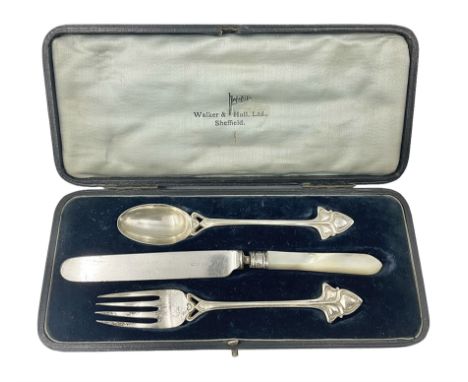 Walker and Hall silver plated Art Nouvea Christening set, comprising knife, fork and spoon, the knife with mother of pearl ha