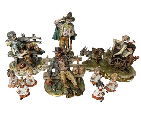 Group of Capodimonte figures, to include musical organ grinder with donkey and monkey, two tramp figures on benches, man with