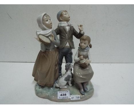 Lladro Children and Dog Singing figure group. Impressed mark K-9 E. 27cm high.