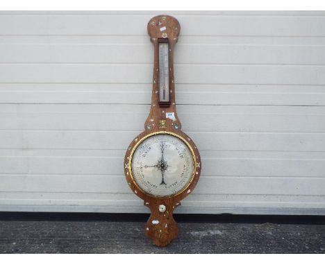 A banjo barometer with inlaid decoration, silvered temperature and barometric dials, approximately 96 cm.