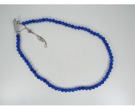 A 147 ct Blue Jade Slider Necklace set with silver issued in a limited edition 1 of 50, size of each stone 6 mm x 6 mm, weigh