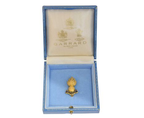 A 9ct gold Garrard Royal Engineers brooch. The Royal Engineers Grenade collar badge with blue enamel detailing, maker's marks