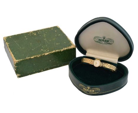 A ladies 1960s 9ct gold Rolex Precision manual wind wristwatch. The signed circular dial with baton markers, signed cal. 1400