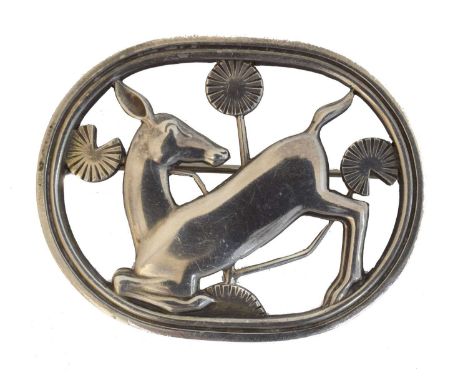 A silver Georg Jensen brooch, no. 256. Designed by Arno Malinowski, featuring a deer in fronds, maker's marks, stamped 925D D