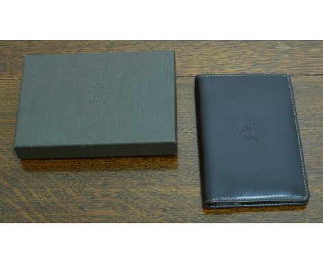 Patek Philippe - A leather mini notebook. In maker's box.