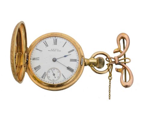 An 18ct gold full hunter fob watch by Waltham. The signed dial with roman numeral markers, outer minutes track and subsidiary