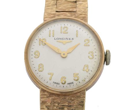 A 9ct gold Longines manual wind wristwatch. The signed dial with Arabic markers and outer minutes track, manual wind movement