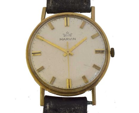 A 1970s 9ct gold Marvin manual wind wristwatch. The signed dial with baton markers and outer minutes track, signed 17 jewel m