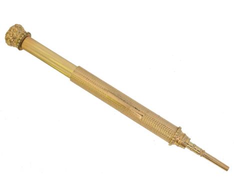 A mechanical pencil by W.S. Hicks. Engine turned, with scrolling surmount, signed W.S. Hicks, New York, length 8.5 to 14.5cm,