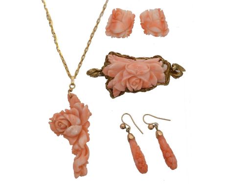 A selection of coral jewellery. To include a carved coral pendant stamped 14k suspended from a 9ct gold chain, two pairs of c