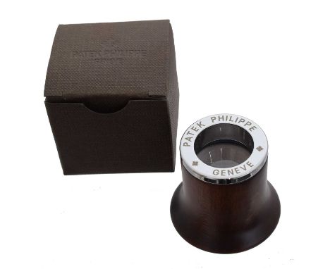 Patek Philippe - An eyeglass/loupe In maker's box.Overall condition goodSigns of very light wear