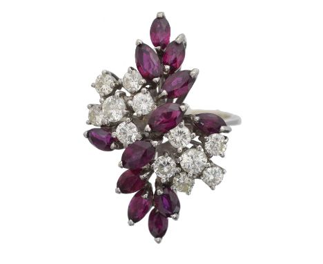 An 18ct gold ruby and diamond cluster ring. Designed as a brilliant cut diamond and marquise shape ruby cluster, import marks