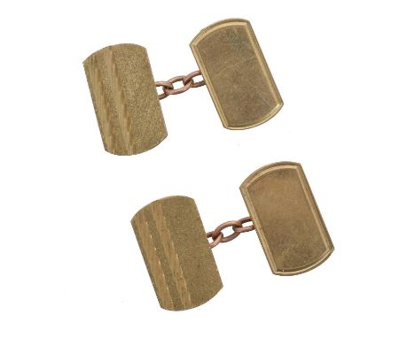 A pair of 9ct gold cufflinks. Each designed as a polished and engine turned rectangular panel with chain spacer, hallmarks fo