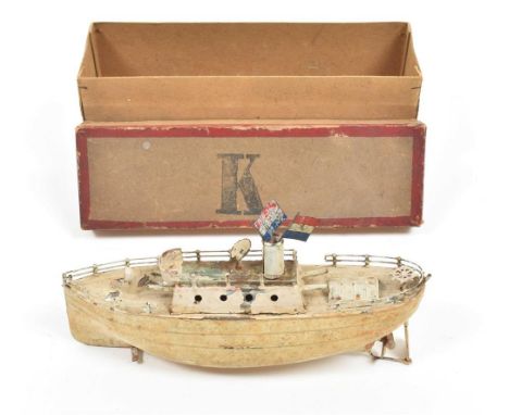 Ca. 1915. Steamboat w. two Dutch flags, 10.5 x 12 x 5.5 cm. In contemp. cardboard box w. stamped letter 'K'. Sl. rusty.