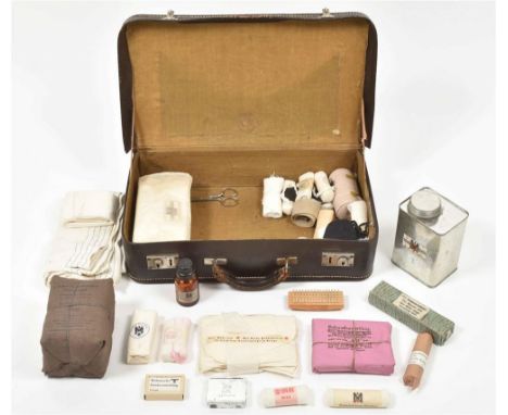 Leather case w. insignia on top, ca. 1940, 26 x 48 x 12 cm. Contents incl. a.o.: approx. 50 bandages of various kinds, metal 
